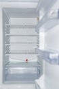 Open empty white refrigerator close-up. Royalty Free Stock Photo