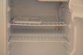 Open empty white refrigerator on defrost close up without food Royalty Free Stock Photo