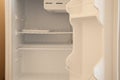 Open empty white refrigerator on defrost close up without food Royalty Free Stock Photo