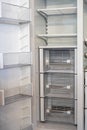 Open empty white refrigerator. Side View of Stainless Steel Double Door Refrigerator. Royalty Free Stock Photo