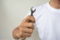 Open-ended wrench in hand a man