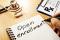 Open enrollment written on a note.