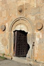 Open entrance door to Gergeti christian church near Kazbegi, Ste