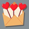 In an open envelope with a letter, caramel on a stick in the form of hearts.