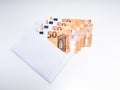 A lot of fifty euro bills in a white envelope on white background Royalty Free Stock Photo