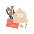 Open envelope with paper handwritten letter. Spring tulips as a gift. The concept of congratulations for Valentines Day Royalty Free Stock Photo