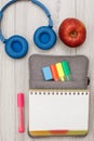 Open exercise book on bag-pencil case with color felt pens and m Royalty Free Stock Photo