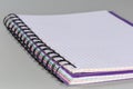 Open exercise book with squared sheets and wire spiral binding Royalty Free Stock Photo