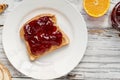 Open Face Peanut Butter and Strawberry Jelly Sandwich with Fruit Royalty Free Stock Photo