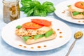 Open-face sandwich with chicken, mozzarella, tomato, pesto and basil on toasted ciabatta, horizontal Royalty Free Stock Photo