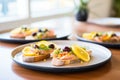 open-faced baked salmon sandwiches on a platter Royalty Free Stock Photo