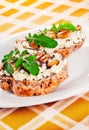 Open faced sandwices with goat cheese, almonds and arugula Royalty Free Stock Photo