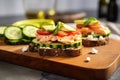 open-faced sandwich with salmon and cucumber on crusted bread