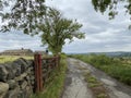 View of, an open farm gate, leading to a farm in, Hawksworth, Yorkshire, UK Royalty Free Stock Photo