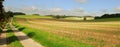 Open field and country road Royalty Free Stock Photo