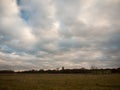 Open field plain autumn grass land sheep church england Royalty Free Stock Photo