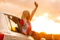 Happy woman girl goes to summer travel trip in car Royalty Free Stock Photo