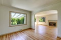 Open floor plan empty living room with polished hardwood floor. Royalty Free Stock Photo