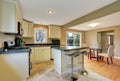 Open floor plan white kitchen room with island and dining area Royalty Free Stock Photo