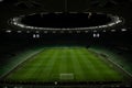 An open football stadium with empty stands with green seats. Royalty Free Stock Photo