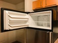 Open freezer door on empty refrigerator Royalty Free Stock Photo