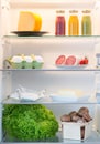 Open fridge filled with food Royalty Free Stock Photo