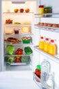 Open fridge filled with food Royalty Free Stock Photo