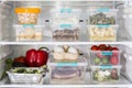 Open fridge with plastic food containers vegetables. High quality and resolution beautiful photo concept Royalty Free Stock Photo