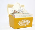 Open front view of vintage 1970s yellow recipe box with recipe cards Royalty Free Stock Photo