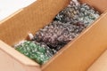 Open full cardboard parcel box with things wrapped in bubble wrap Royalty Free Stock Photo