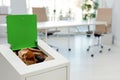 Open full trash bin in modern office. Waste recycling Royalty Free Stock Photo