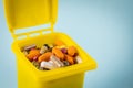 Open garbage can full of pills, Concept, medical waste, Disposal of expired drugs Royalty Free Stock Photo