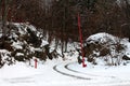 Open gate entrance on snow covered forest road Royalty Free Stock Photo