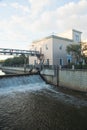 Open gateway on river in summer day