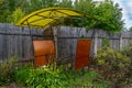 Open gazebo with table and bench under the roof.