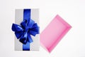 Open gift box with Blue ribbon on white background Royalty Free Stock Photo