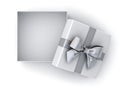 Open gift box , Christmas present box silver ribbon bow and empty space in the box isolated on white background Royalty Free Stock Photo