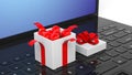 Open gift box full of Christmas balls on laptop Royalty Free Stock Photo