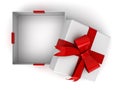 Open gift box or present box with red ribbon bow and blank space in the box isolated on white background with shadow Royalty Free Stock Photo