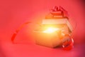 Open Gift Box rays light on red background red present box with red ribbon bow for Merry Christmas Holiday Happy new year