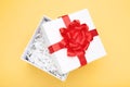 Open gift box with bow and shredded paper Royalty Free Stock Photo