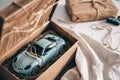 open gift box with a remotecontrol car inside, on a white backdrop Royalty Free Stock Photo