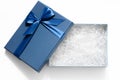 Open gift box with shredded paper on a white background