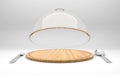 Open glass dome on wooden plate with spoon and fork