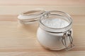 Open glass jar of baking soda