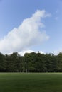 Open Grassland With Massive Cloud Rising Above Royalty Free Stock Photo