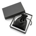 Black Drawstring Pouch Inside an Open Gray Gift Box on White Background Keywords: gift box, gift, present, packaging, box, lid, Royalty Free Stock Photo