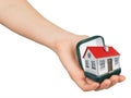 Open green ring box with house in humans hand