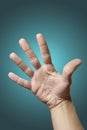 Open hand on gradient blue background Royalty Free Stock Photo