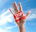 Open hand raised with the text: Stop Diabetes on sky background Royalty Free Stock Photo